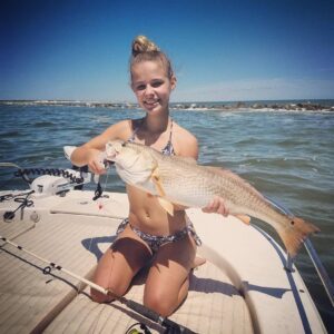 My baby girl caught her first red drum! A nice 30″ bull caught on a finger mulle…
