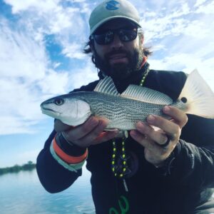 dressed for Mardi Gras and fishing for reds on the Lagoon.        …