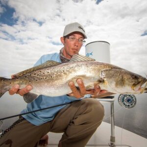 Capt. Justin Price’s big belly speckled Trout in the Mosquito Lagoon.        …