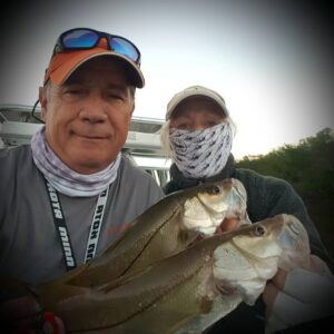 Double dating with  … plenty of snook and trout … the gator did not care tha