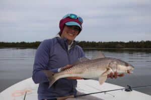 Ash with a perfect redfish that slurped up her shrimp fly!

Photo: